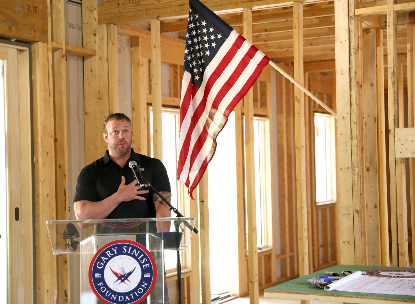 Retired U.S. Army Chief Warrant Officer 2 Patrick Scrogin, who was critically wounded in a helicopter crash while deployed in Iraq in March 2007, speaks inside his under-construction home in St. Charles on Friday, July 14, 2023. The Gary Sinise Foundation’s R.I.S.E. (Restoring Independence, Supporting Empowerment) Program is building the home along with in-kind donations from various national partners, sub-contractors, and the American public.