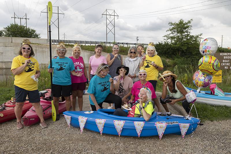 The Sisters gather around Nancy for a picture before the float Wednesday, July 24, 2024.