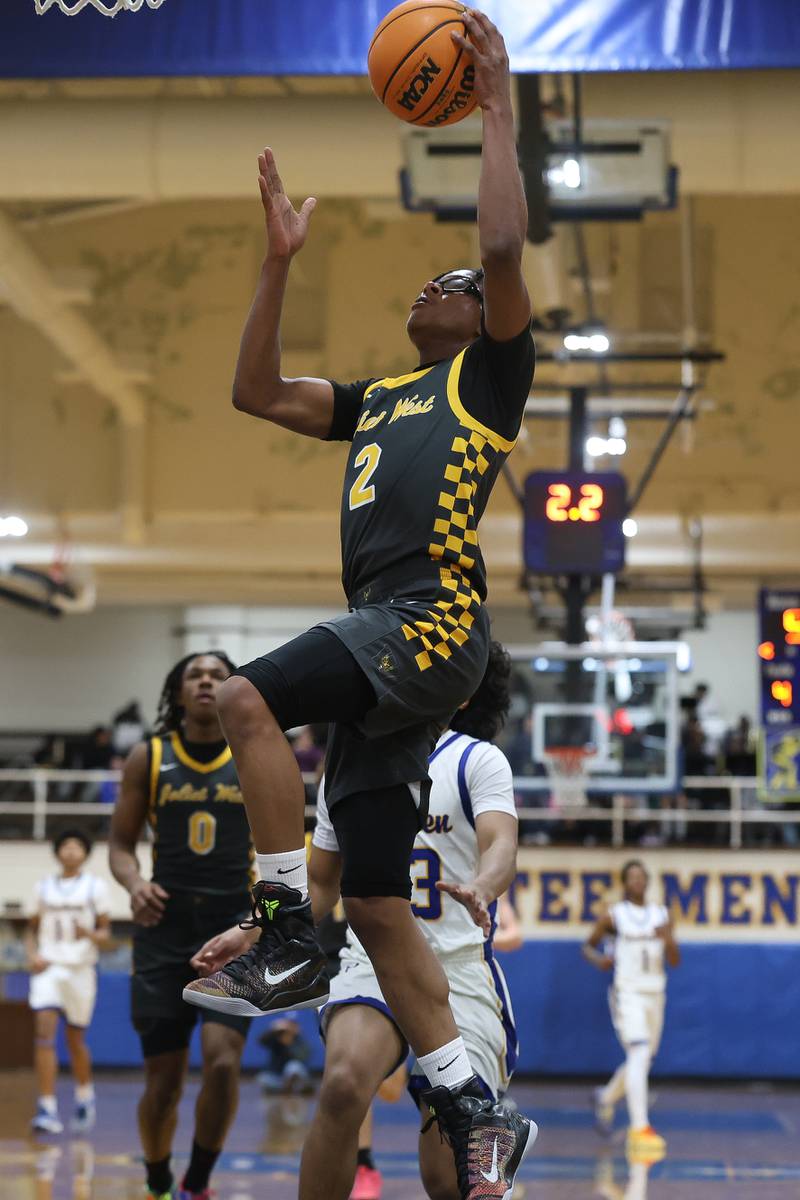 Joliet West’s Elijah Wilson lays in a shot against Joliet Central on Thursday, Jan. 15, 2026 in Joliet.