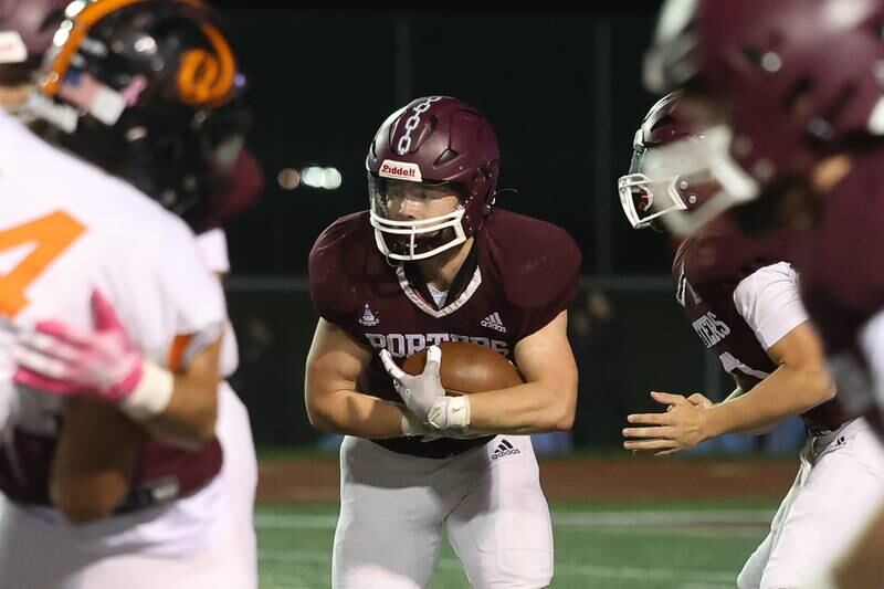 Lockport’s Tyler Pospisil takes the handoff against Lincoln-Way West on Friday, Oct. 18, 2024 in Lockport.