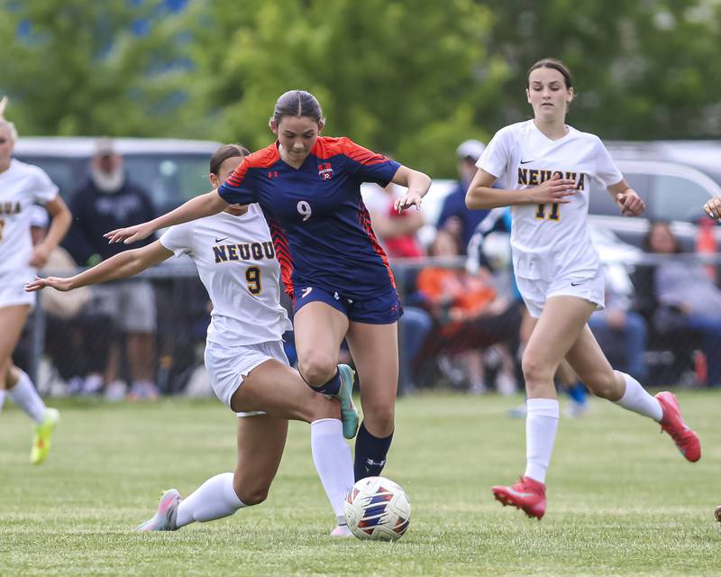 Neuqua Valley's Sarah Shannon (9) defends Oswego's Elizabeth Johnson (9) during Class 3A regional final soccer match between Neuqua Valley at Oswego on Saturday, May 23, 2026 in Oswego.