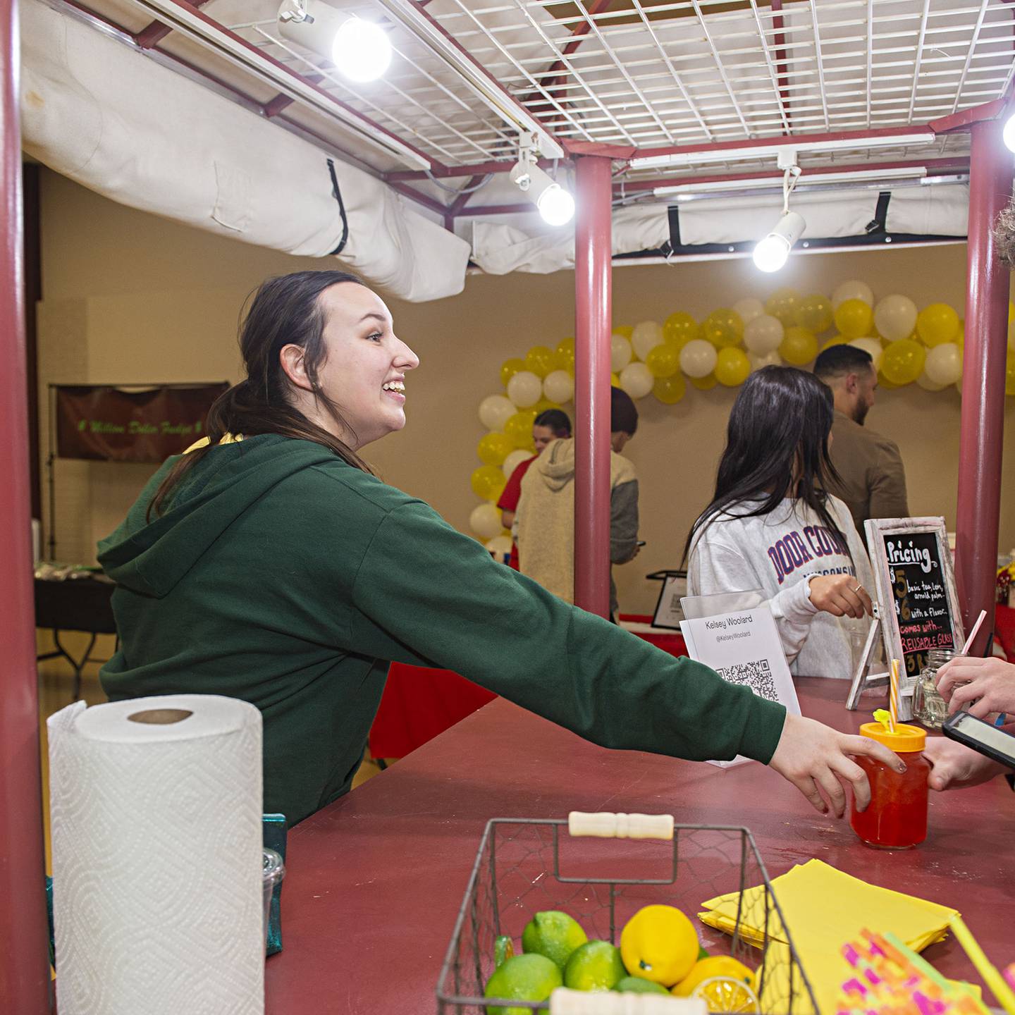 Dixon High School senior Kelsey Woolard serves up a strawberry lemonade Thursday, April 28, 2022 at her Whiteside Area Career Center CEO trade show booth. Her shop, dubbed “Lady Lemonade,” Woolard cut her teeth on the refreshment biz from working an annual garage sale in her neighborhood.