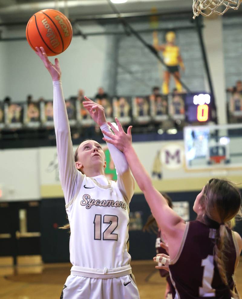 Sycamore's Sadie Lang shoots over Morris' Cami Pfeifer during their game Tuesday, Jan. 13, 2026, at Sycamore High School.