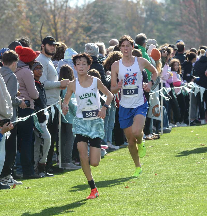 Morrison's Isaiah McDearmon chases Rock Island Alleman's Cristiano Saucedo to the finish line at the 1A Rock Island Cross Country Sectional on Saturday, Nov. 2, 2024 at Saukie Golf Course in Rock Island.