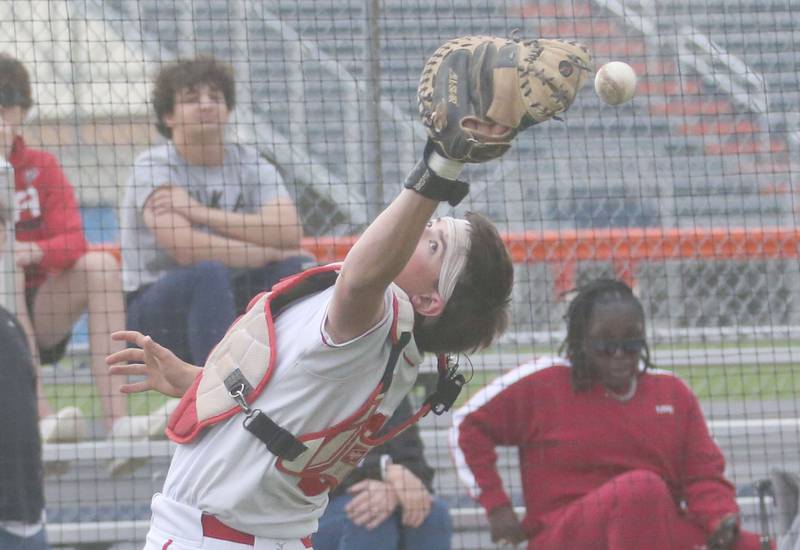Ottawa catcher Mason Jaegel misses a pop fly behind home plate during the Class 3A Regional semifinal game on Thursday, May 29, 2025 at Pontiac High School.