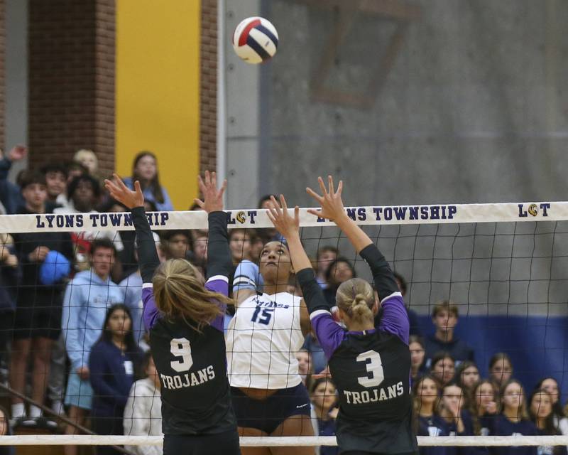 Downers Grove South's Ciara Steward (15) lines up a kill during Class 4A Lyons Sectional Semifinal volleyball match between Downers Grove South at Downers Grove North. Nov 4, 2025 in La Grange.