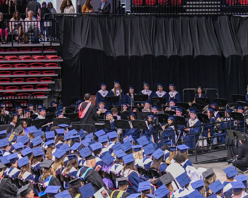 Oswego East’s band seniors preform a piece during graduation on Saturday May 17, 2025, held at the Convocation Center in DeKalb.