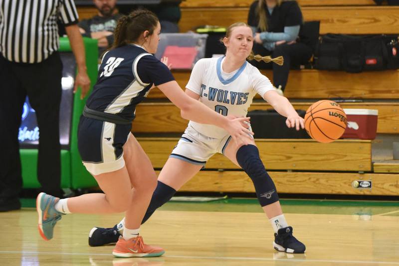 Cissna Park's Addison Lucht, right, makes a bounce pass as Ridgeview's Kamryn Rinkenberger defends during an IHSA Class 1A Dwight Regional semifinal at Dwight Township High School Monday, Feb. 17, 2025.