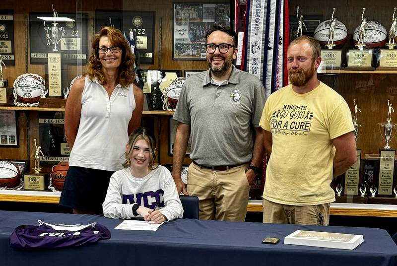 Fieldcrest senior Tatiana Serna (seated) recently signed a letter of intent to run cross country at IVCC. She was joined at the signing by (from left) Fieldcrest coach Carol Bauer, IVCC coach Matt Baker and Fieldcrest coach Michael Hamer.