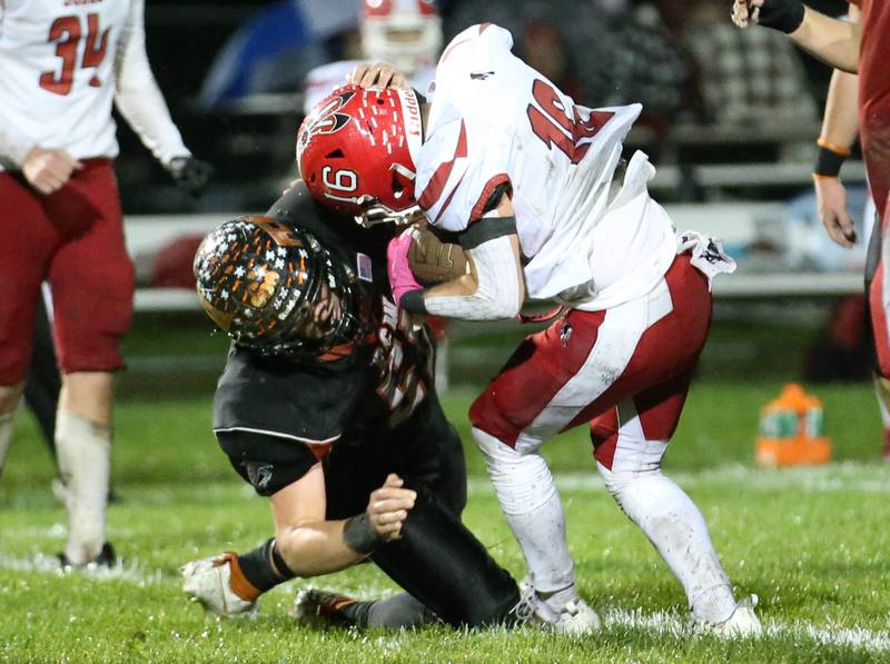 Flanagan-Cornell/Woodland's Kesler Collins sacks South Beloit quarterback Noah Zwerenz during the first round of the 8-man football playoffs on Friday, Oct. 27, 2023 in Flanagan.