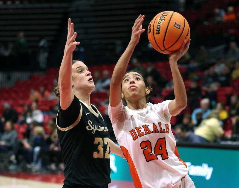 DeKalb's Nazeria Dean goes to the basket against Sycamore's Quinn Carrier Friday, Jan. 30, 2026, during their game in the FNBO Challenge in the Convocation Center at Northern Illinois University in DeKalb.