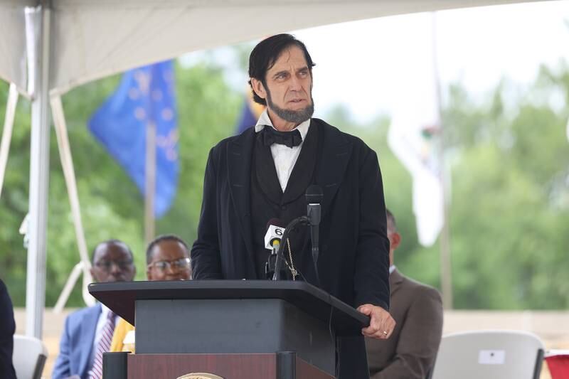 Randy Duncan, Abraham Lincoln re-enactor, speaks at the National Cemetery Administration 50th Anniversary ceremony at the Abraham Lincoln National Cemetery in Elwood on Saturday, July 29.