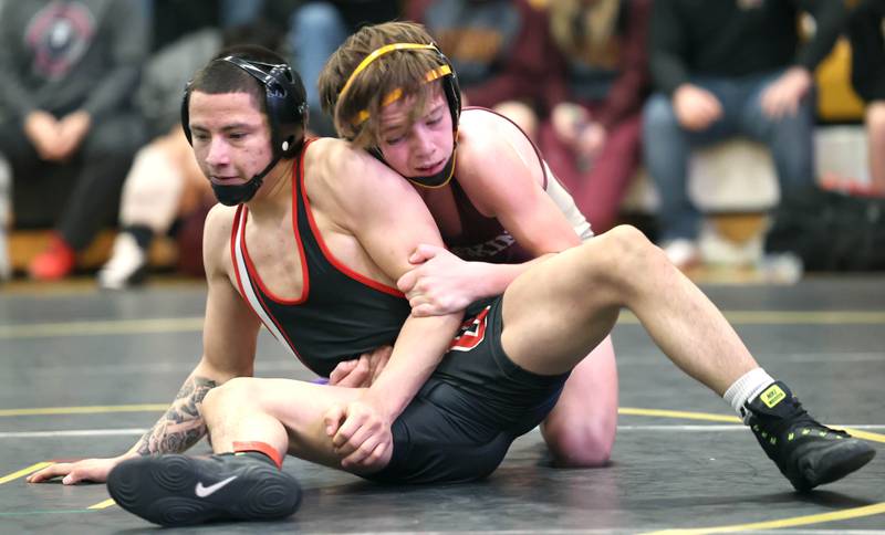 Ottawa’s Ivan Munoz and Morris’ Owen Sater wrestle at 106 pounds Saturday Jan. 21, 2023, during the Interstate 8 Conference wrestling tournament at Sycamore High School.
