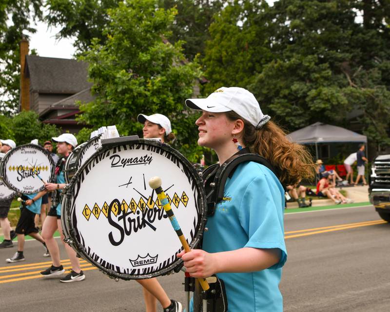 Crystal Lake Strikers drum their way down the parade route on Friday July 4, 2025, during the Independence Day parade in downtown Downers Grove.