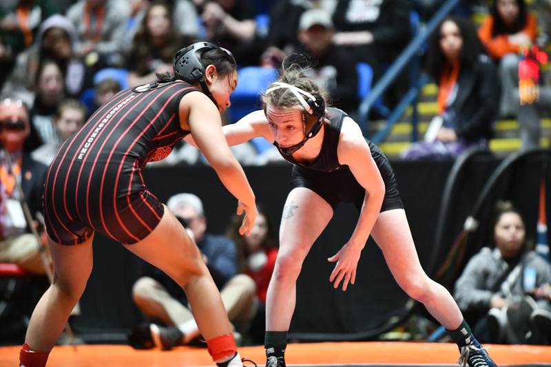 Katelyn Bell of Montini, right, wrestles in the 100-pound championship match in the IHSA Girls Individual State Finals on Saturday, March 1. Bell took second place to Saya Hongmoungkhoune of Rockford East.