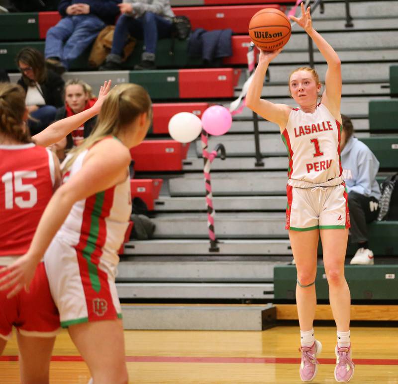 L-P's Addiosn Dutlinger shoots a wide-open shot as teammate Olivia Shetterly sets a pick on Ottawa's Hailey Larsen on Friday, Jan. 27, 2023 at L-P High School.