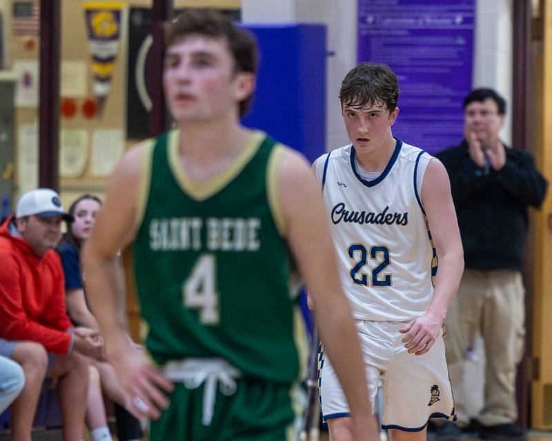 Marquette's Griffin Dobberstein (22) looks towards St. Bede's Gino Ferrari during the Class 1A Regional Boys Basketball Championship game on Friday, Feb. 27, 2026 at Serena High School.