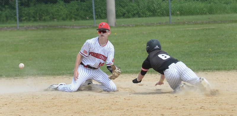 Fulton's Dane VanZuiden beats the throw to second as Forreston's Brady Gill waits for the ball at the 1A Amboy Regional on Saturday, May 24, 2025.