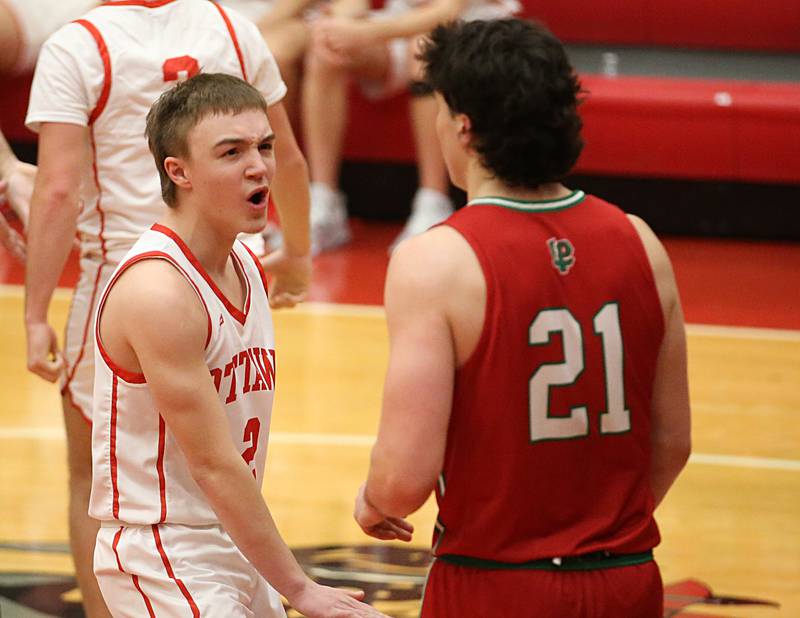 Ottawa's Huston Hart reacts in front of L-P's Josh Seneca in the final few minutes while gaining the lead over L-P in Kingman Gymnasium on Friday, Feb. 10, 2023 at Ottawa High School.