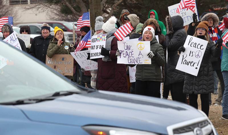 A vehicle stops to argue with protesters Thursday, Feb. 5, 2026, in front of Genoa-Kingston High School. The group is protesting the “History Rocks” assembly which is part of a nationwide campaign by the U.S Department of Education tied to the nation’s 250th anniversary and organized by the high school’s Turning Point USA, Club America chapter, a nonprofit founded in 2012 by the late Charlie Kirk.