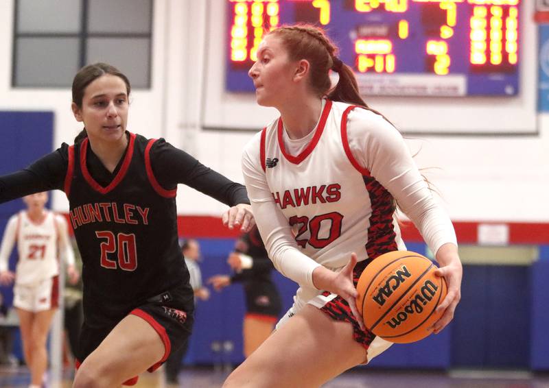 Huntley’s Alyssa Borzych, left, guards Maine South’s Ally Pape in Komaromy Holiday Classic varsity girls basketball championship game action on Monday, Dec. 30, 2024, at Dundee-Crown High School in Carpentersville.