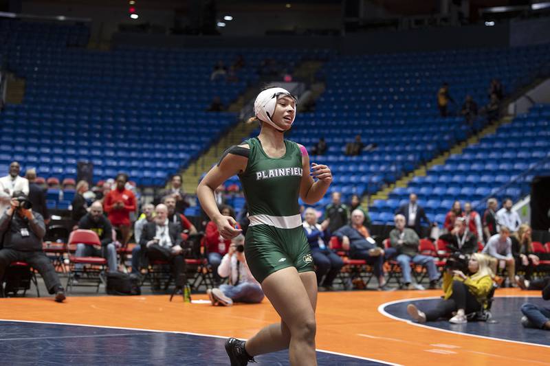 Alicia Tucker of Plainfield celebrates her title in the 155 pound title match at the IHSA girls state wrestling championships Saturday, Feb. 25, 2023.