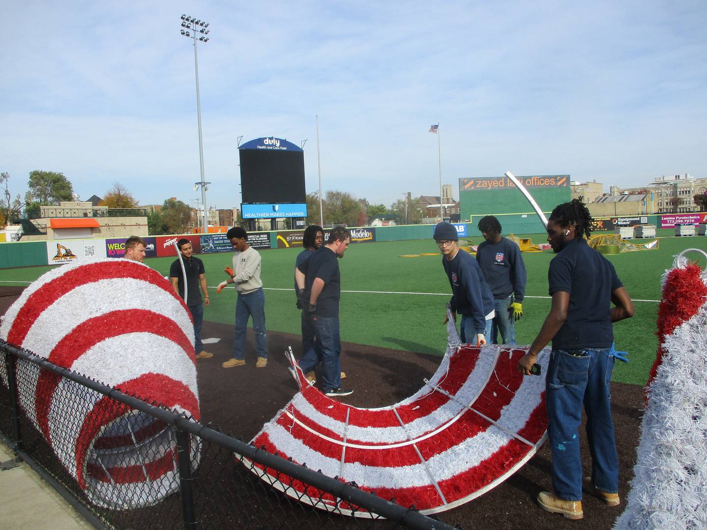 A work crew from Joliet Job Corps is assembling lights and decorations for the Glow Holiday Fest at Slammers Stadium in Joliet. Oct. 29, 2024