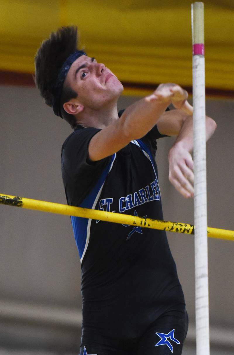St. Charles North’s Charles Algera clears the pole vault bar during the DuKane boys indoor track meet at Batavia High School Saturday.