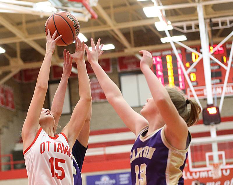 Ottawa's Hailey Larsen (left) grabs a rebound over Canton's Karlee Zumstein (13) during the Lady Pirate Holiday Tournament on Wednesday, Dec. 21, 2022 in Ottawa.