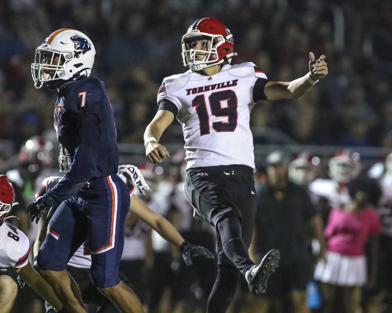 Yorkville's Kyle Nadler (19) follows through on a successful field goal attempt during football game between Yorkville at Oswego Friday, Sept 26, 2025 in Oswego.