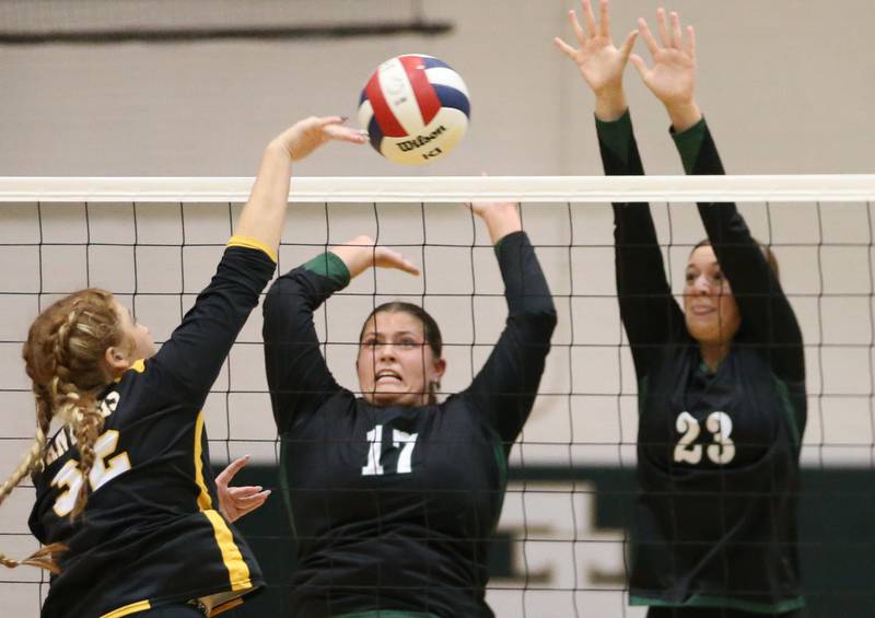 Putnam County's Maggie Spratt hits the ball past St. Bede's Ava Balestri and teammate Mary Quinn McClain on Tuesday, Sept. 24, 2024 at St. Bede Academy.
