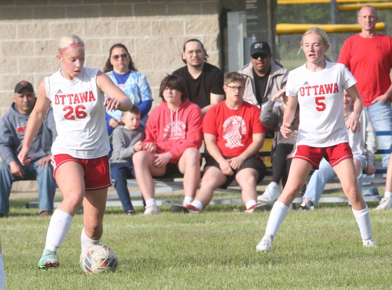 Ottawa's Taylor Brandt pushes the ball ahead to teammate Anastacia Zegis against Streator during the Class 2A Regional game on Friday, May 10, 2024 at James Street Recreation Complex in Streator.