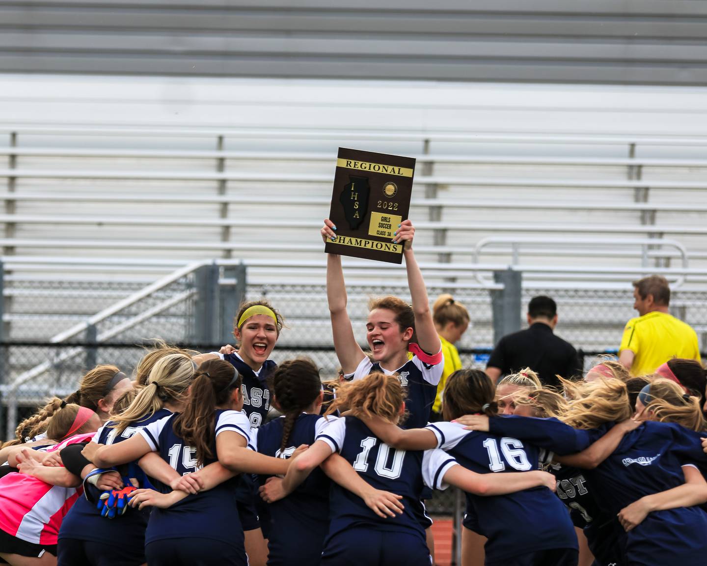 Oswego East celebrates their victory over Oswego for the Class 3A East Aurora Regional final. May 20, 2022