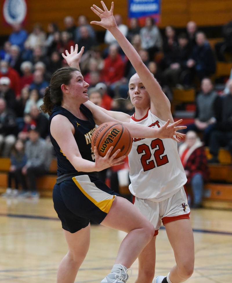 Neuqua Valley's Nalia Clifford goes up for a shot past Benet's Bridget Rifenburg (22) during Tuesday’s IHSA Class 4A regional semifinal girls basketball game in Aurora.