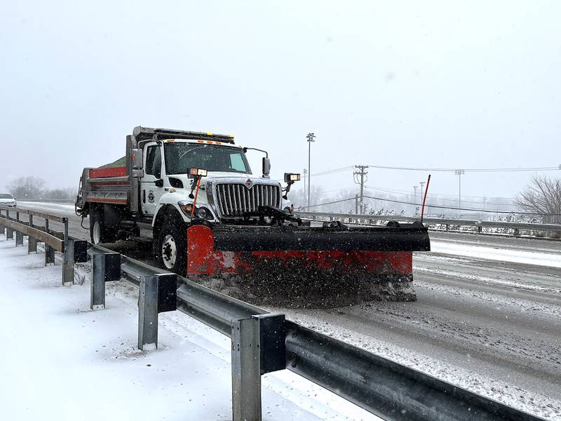 A snowplow vehicle on Black Road in Joliet on Wednesday, Feb. 12, 2025.