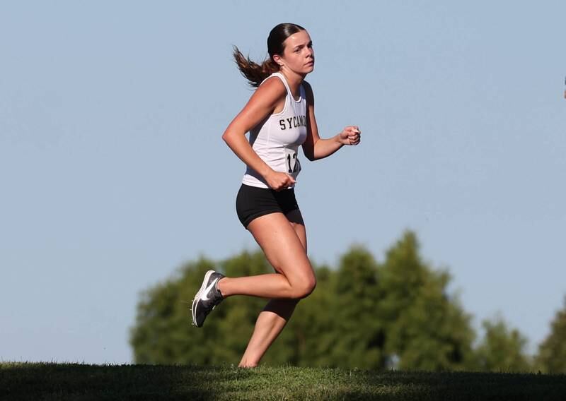 Sycamore’s Layla Janisch runs the girls varsity race Tuesday, Sept. 3, 2024, at the Sycamore Cross Country Invite at Kishwaukee College in Malta.