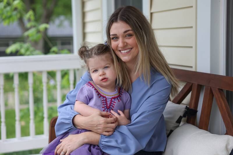 Kristin Dziuban Walls, who suffered a stroke on Thanksgiving day last year, sits with her daughter Mila, 1, at her home on Friday, May 10, 2024 in Morris.