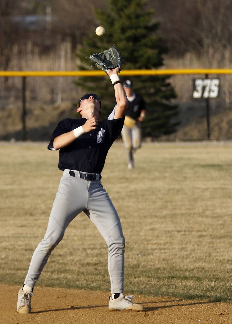 Cary-Grove's Francis Panko tracks down a pop up during a nonconference baseball game against Woodstock North on Monday, March 30, 2026, at Woodstock North High School.