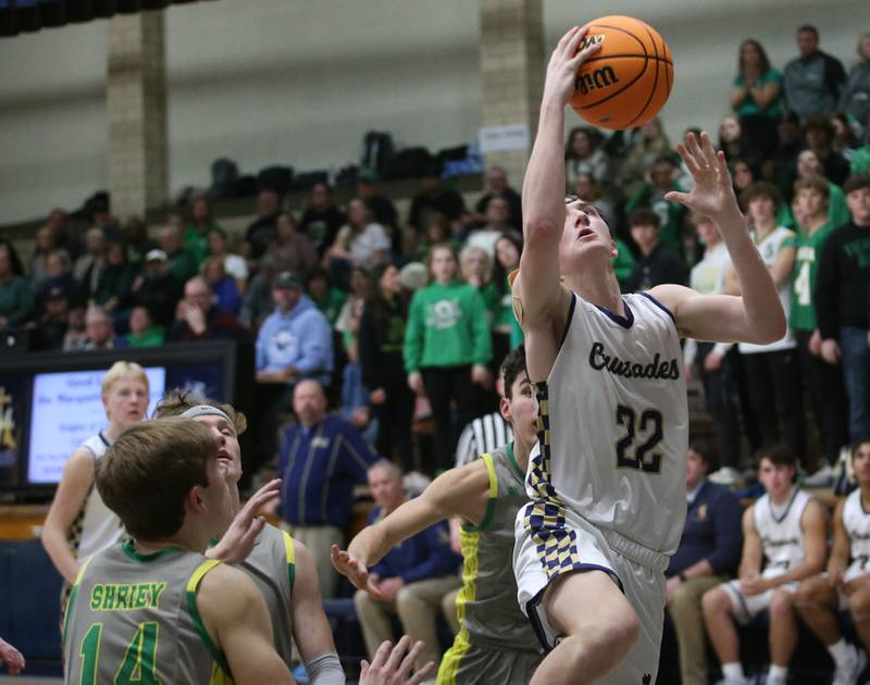 Marquette's Griffin Dobberstein eyes the hoop as Seneca's Brady Sheedy defends on Friday, Feb. 21, 2025 in Bader Gym at Marquette Academy.