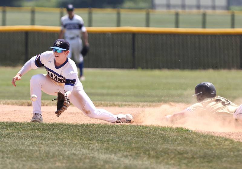 Sycamore's Lucas Winburn slides in safely with a stolen base as Burlington Central's Brady Gilroy takes the throw during their Class 3A sectional final game against Sycamore Saturday, June 3, 2023, at Kaneland High School in Maple Park.