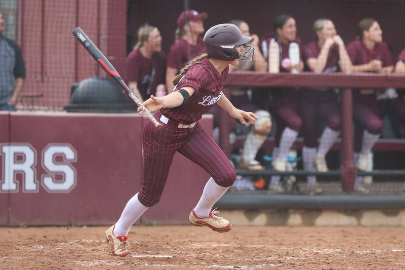 Lockport’s Taylor Lane eyes the ball fall in the outfield for a double against Lincoln-Way East on Monday, April 13, 2026 in Lockport.