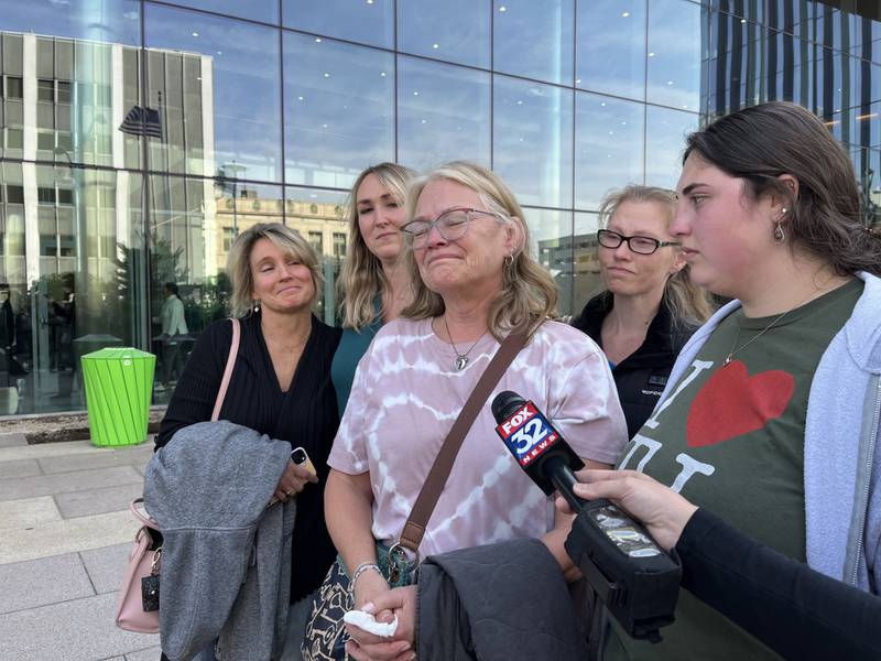 Shirley Onderisin (center), mother of Ashtin Eaton, 32, and grandmother of 14-month-old Hazel Bryant, speaks with reporters on Friday Oct. 11, 2024, outside the Will County Courthouse in Joliet.