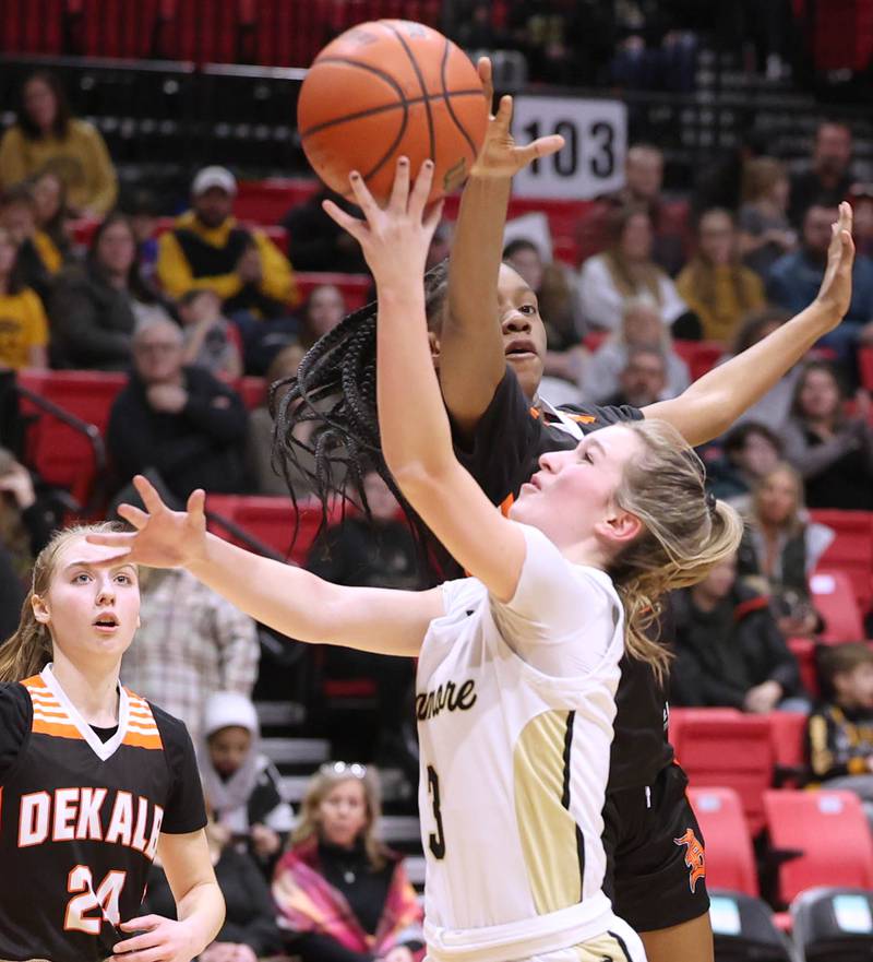 Sycamore's Malerie Morey gets a shot off in front of DeKalb’s Brytasia Long during the First National Challenge Friday, Jan. 27, 2023, at The Convocation Center on the campus of Northern Illinois University in DeKalb.