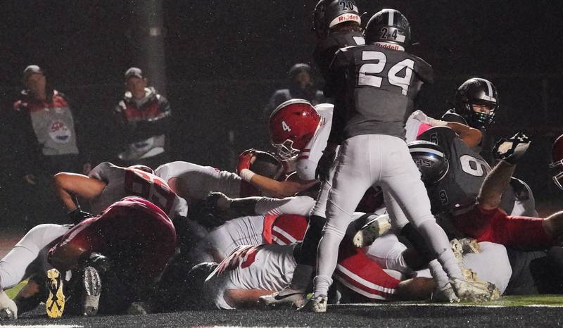 Yorkville's Josh Gettemy (4) carries the ball for a touchdown against Oswego East during a football game at Yorkville High School on Friday, Oct. 13, 2023.