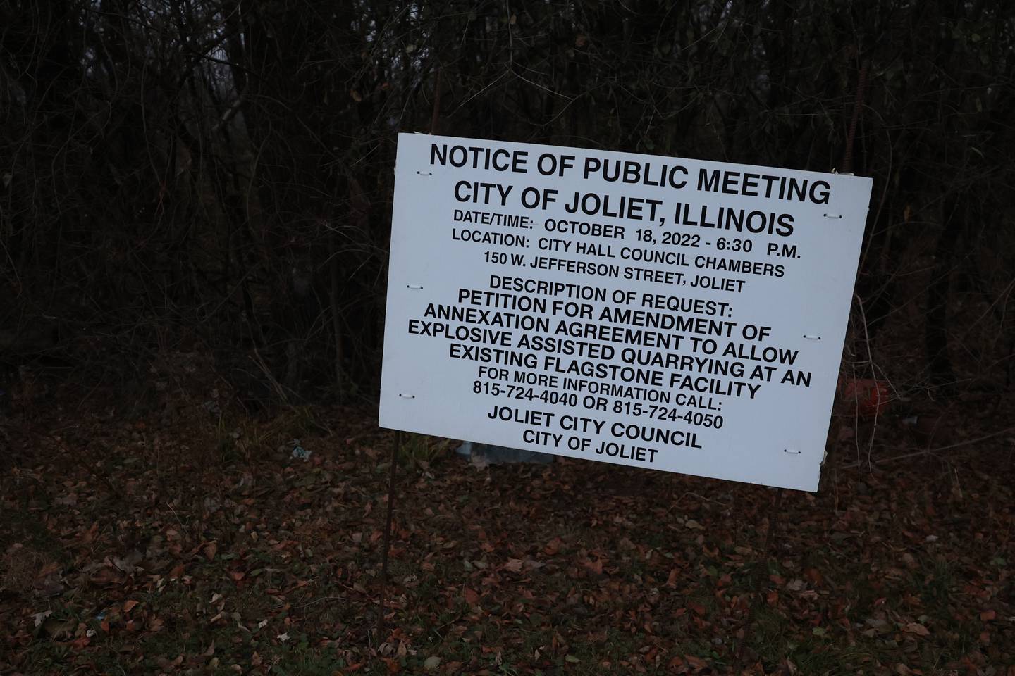 A public notice is posted at the site of a quarry east of Sandall Place in Joliet.