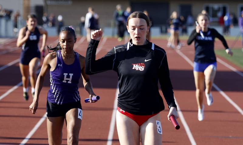 Huntley’s Addison Busam crosses the finish line as she runs the last leg of the 4x100 meter relay on Thursday, May 7, 2026, during the Fox Valley Conference Girls Track and Field Meet at Huntley High School.