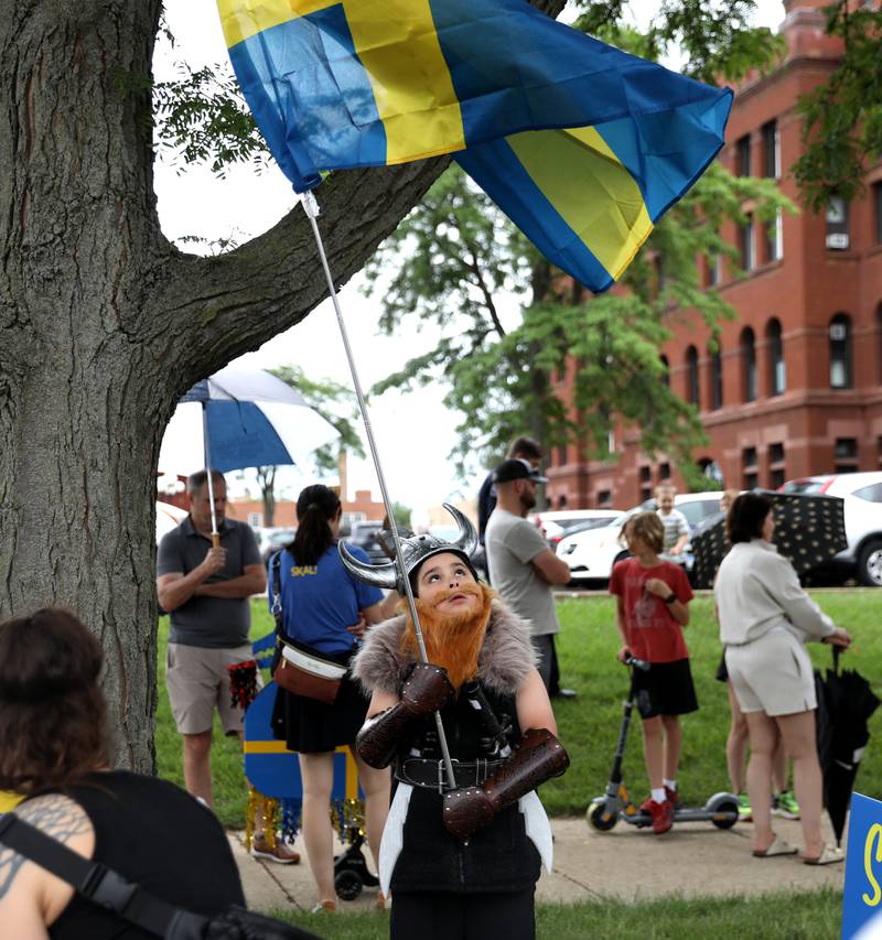 Jesus Rodriguez, 8, of Geneva flies a Swedish flag dressed as a viking as participants line up for the annual Swedish Days Kids’ Day Parade on Friday, June 20, 2025 in Geneva.