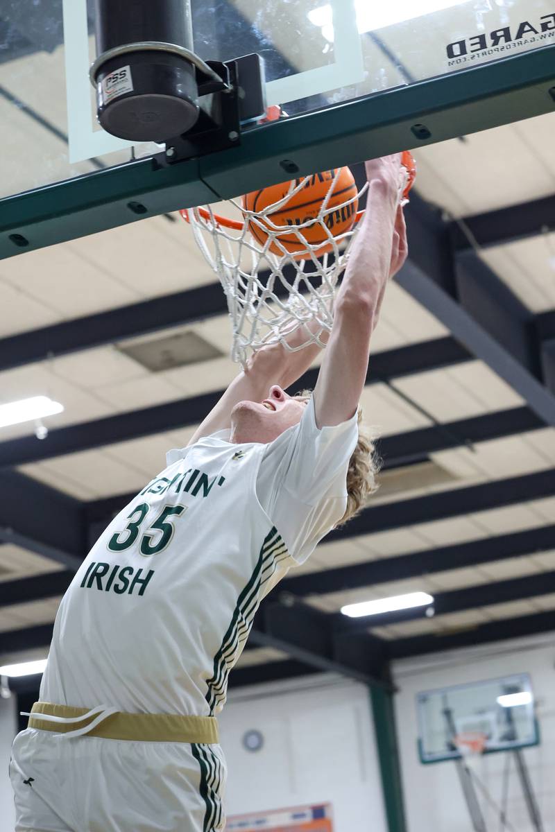 Bishop McNamara's Richard Darr dunks the ball during the Fightin' Irish's 62-25 victory over Chesterton Academy on Wednesday, Jan. 7, 2026.