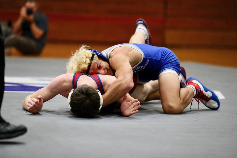 Princeton's Kaydin Gibson looks for a pin against Morrison Thursday night at Prouty Gym.