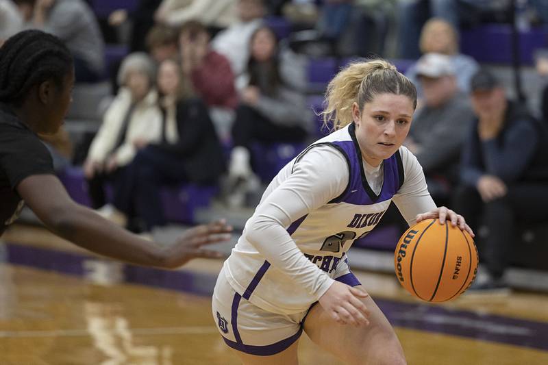 Dixon’s Presley Lappin looks to put up a shot against Kaneland’s Daniela Ridolfi (left) and Lillyana Crawford Wednesday, Dec. 10, 2025.